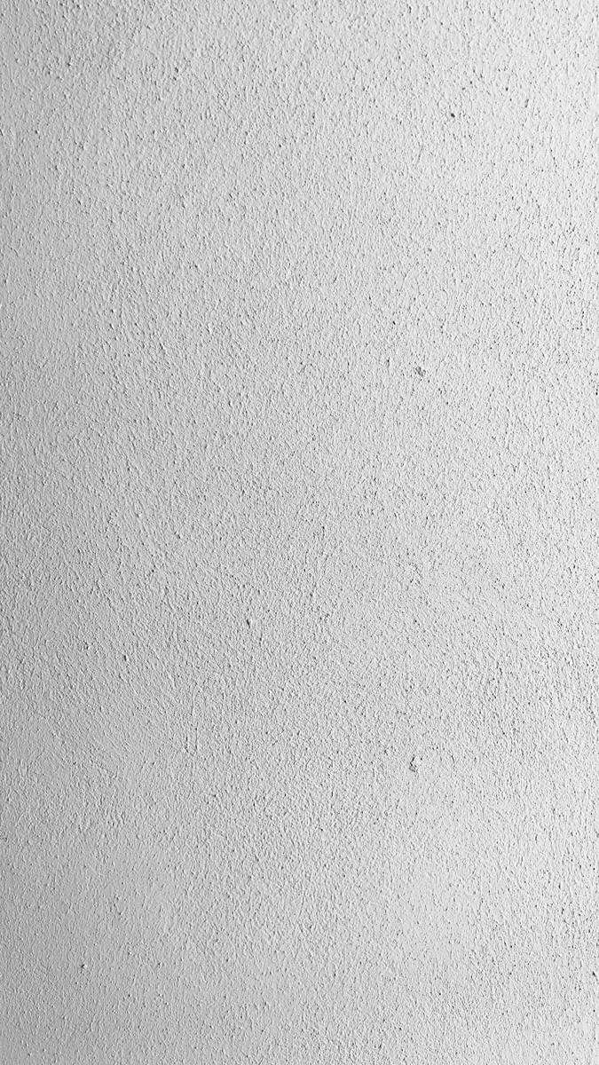 Een lichte pleisterstructuur van dichtbij. — illustratieve foto